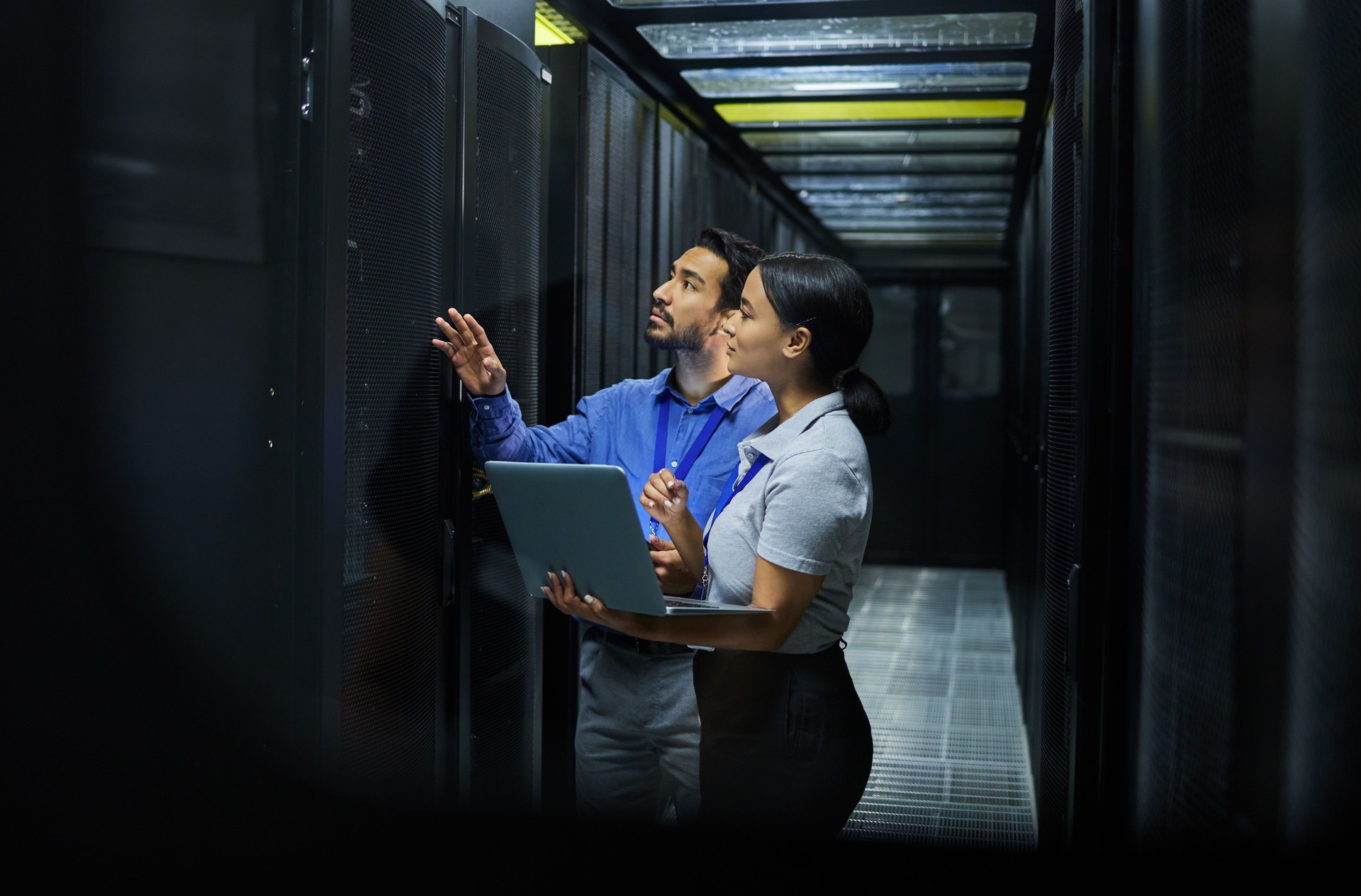 Server room, network laptop and people software management, system upgrade and cyber security. Teamwork technician, engineering or programmer staff on computer, information technology or programming